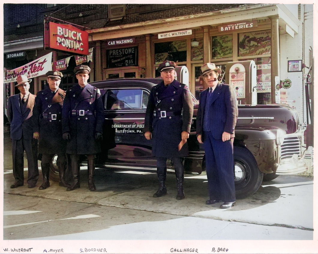 Colorized grayscale photo of new police cruiser, with five members of police department in front